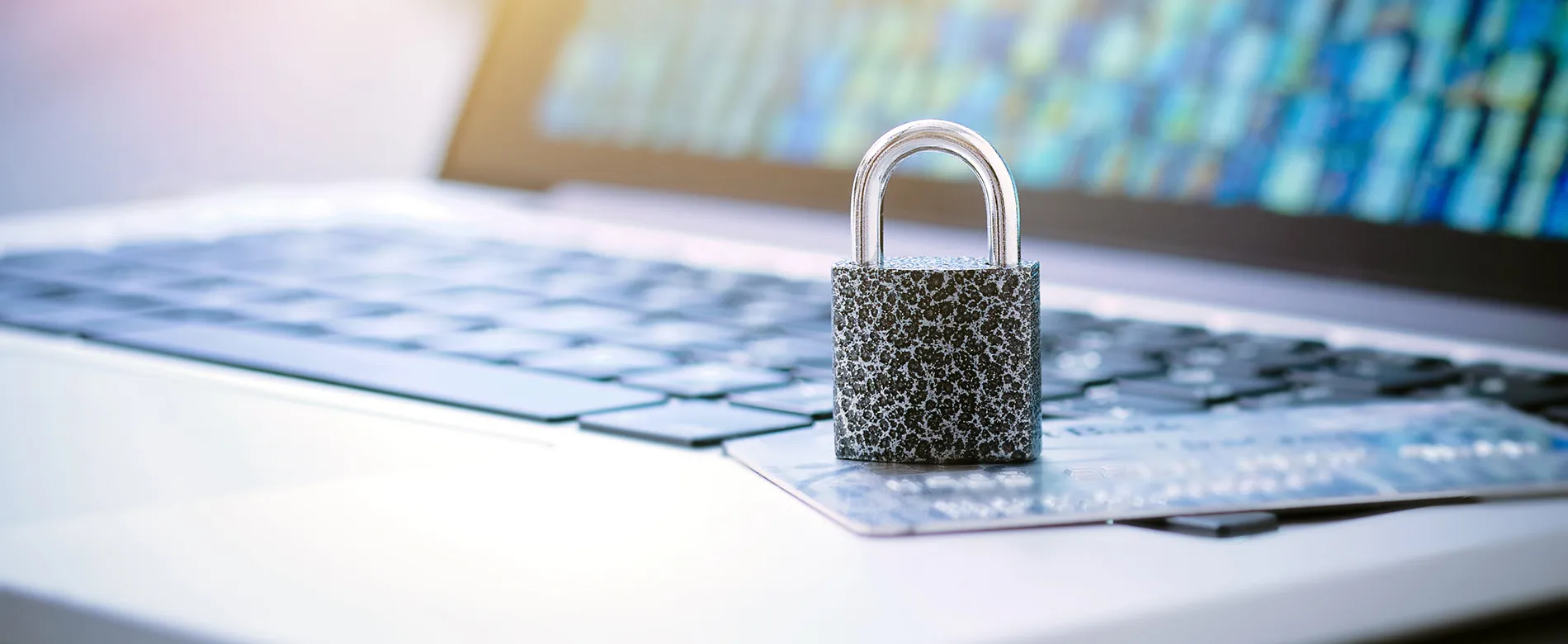 Bank cards on laptop with security padlock