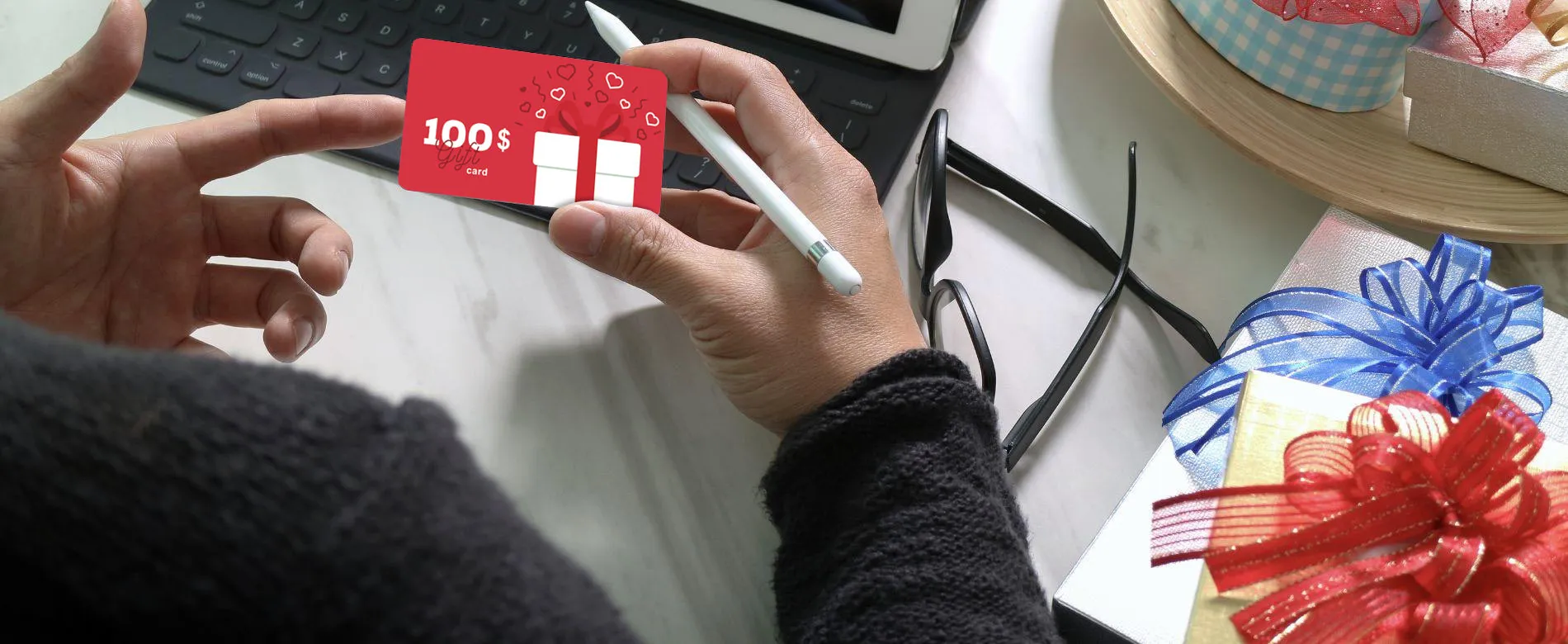 Hand holding a gift card - Integration of CardServ into Thames Technology's parent company Paragon ID