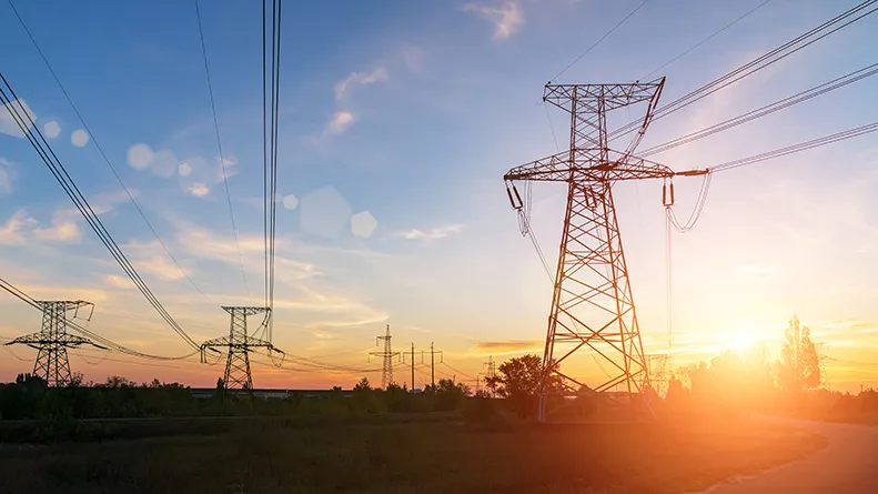 Electricity pylons at sunset