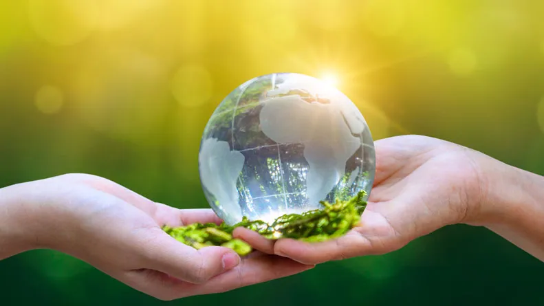 People holding the planet in the palm of their hands